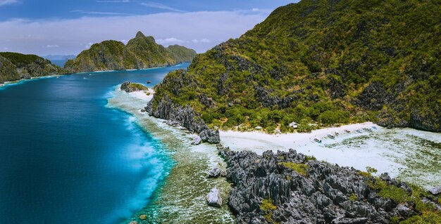 Aerial panoramic view of karst sharp cliffs of limestone island on adventures tour of El Nido