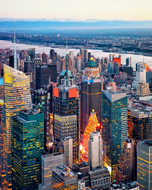 Aerial panoramic view. on Midtown district of Manhattan in New York. Hudson river is on the background. Metropolitan City skyline, USA. American architecture building. Panorama of Metropolis NYC