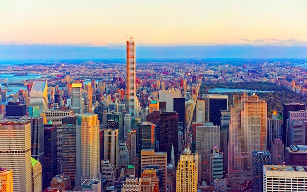 Aerial panoramic view to Midtown Manhattan and Central Park, NYC, USA. Skyline with skyscrapers at sunset. New York city. American architecture building. Panorama of Metropolis. Cityscape