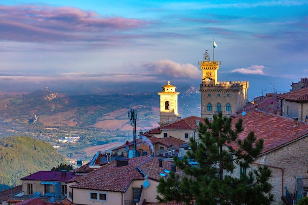 Aerial panoramic view of San Marino cityscape with Palazzo Pubblico town hall of the City of San Marino at sunrise Republic of San Marino