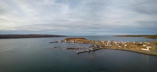 Aerial panoramic view of a small town on a rocky Atlantic Ocean Coast Newfoundland Canada