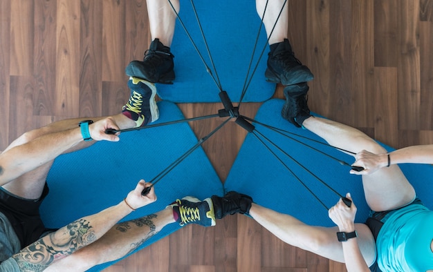 Aerial photo of a group of people pulling bungee cords in a gym