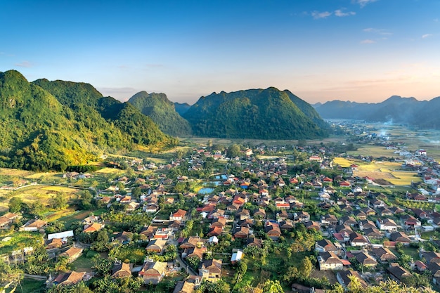 Aerial photo of a village and mountains photo