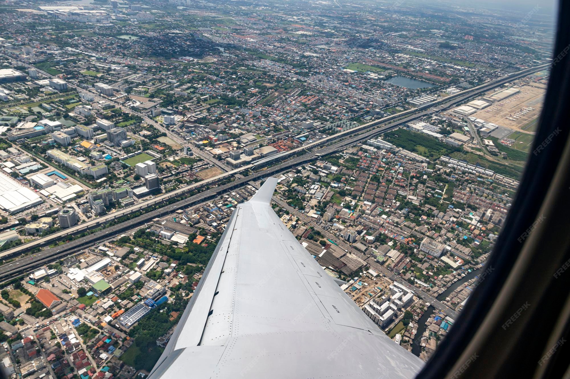 Premium Photo Aerial photograph of don mueang district from private plane the train track are