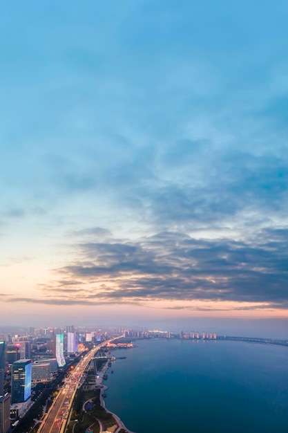 Aerial photography of the city night scene on the west coast of\
qingdao