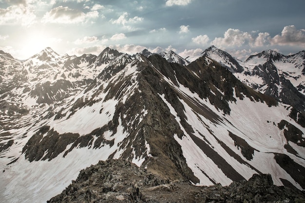 Aerial photography from a drone of the snow-capped Musales peak in the Tena Valley of