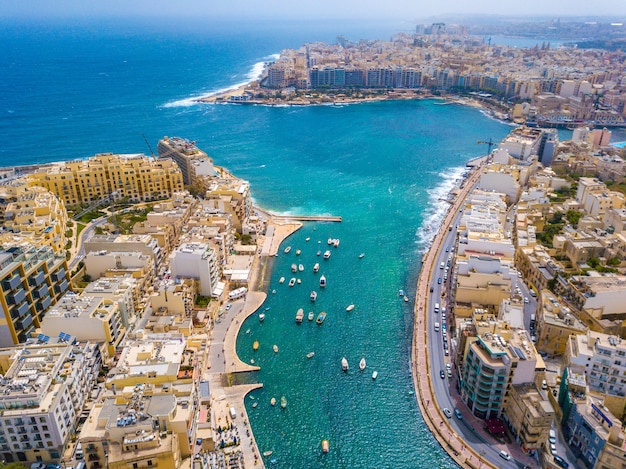 Aerial shot of a cityscape near the sea at daytime