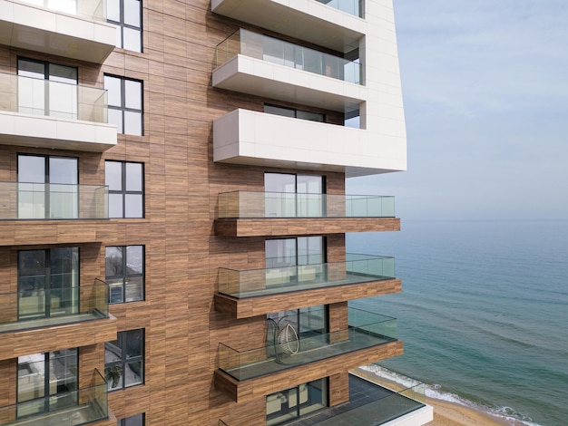 Aerial shot of modern luxury hotel facade with sea view