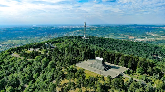 Aerial shot of Monument to the Unknown Hero and TV Tower on Avala mountain,Serbia