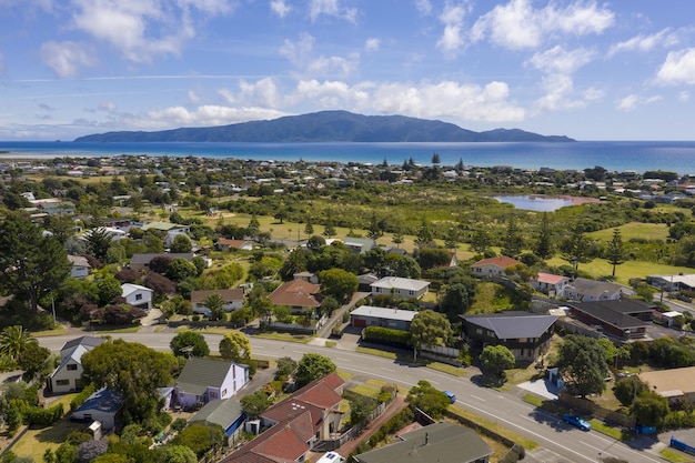 Aerial shot of Waikanae Beach Suburb in New Zealand, with Kapiti Island in the background