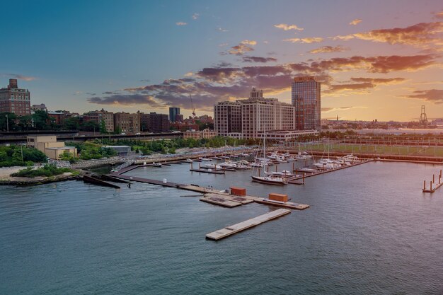 Aerial over small marina on a dock basin in small harbor, aerial view famous summer