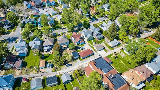 Aerial suburban homes two stories tall houses in neighborhood during summer