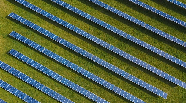 Aerial top down photo of solar panels PV modules mounted on ground photovoltaic solar panels absorb sunlight as a source of energy to generate electricity creating sustainable energy