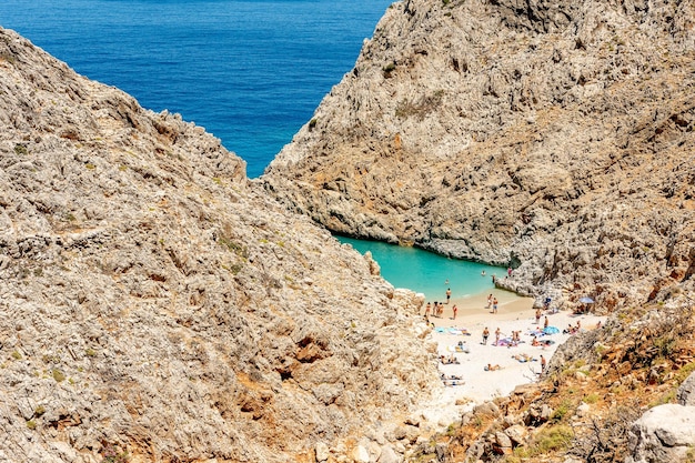 Aerial top view of beach of Seitan Limania in bay with turquoise water