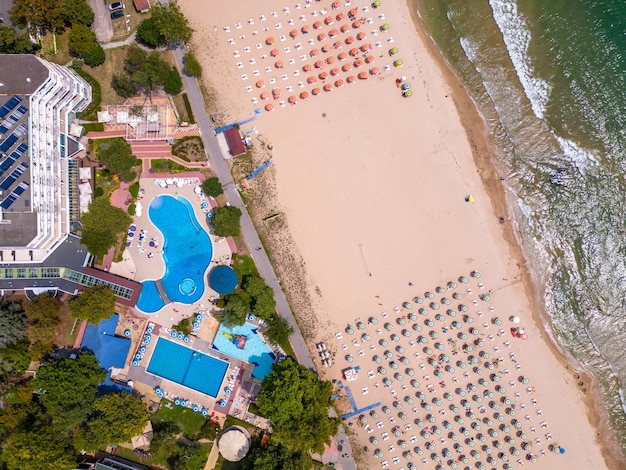 aerial top view of Bulgaria's Albena Sands resort during the summer season an array of hotels pools and crowds of people enjoying the sea