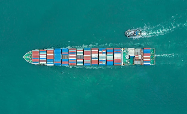 Aerial top view of cargo ship carrying container for import\
export goods to customer