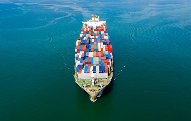 Aerial top view of cargo ship carrying container for import export goods to customer