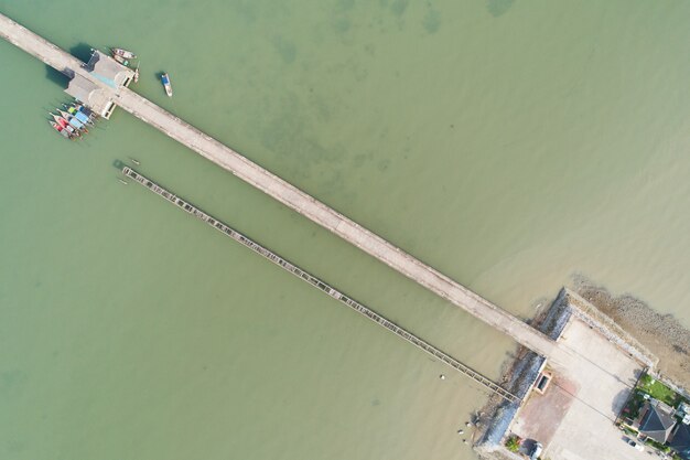 Aerial top view drone shot of small bridge in the sea image transportation background concept and travel design.