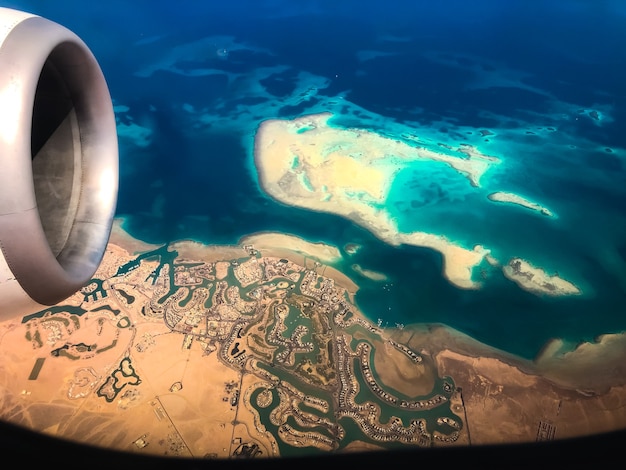 Aerial top view from airplane coastline Egyptian Desert islands. Red sea Sharm Al Sheikh Egypt. 