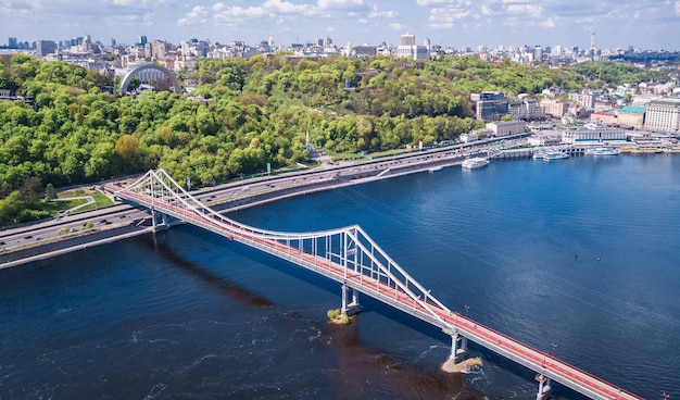 Aerial top view of Kiev city from above Kyiv skyline hills Park bridge and Dnieper river