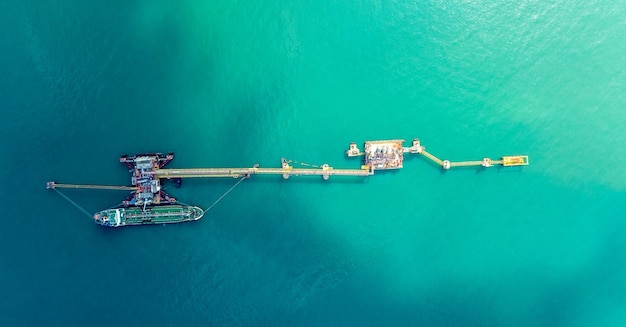 Aerial top view of lpg gas tanker ship at crude oil terminal\
for load or unload concept business logistic and\
transportation