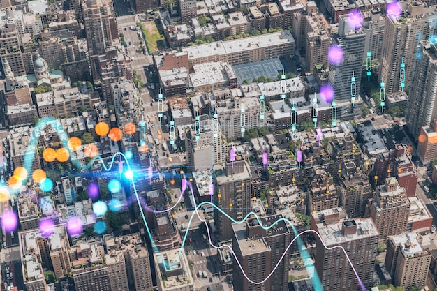 Aerial top view of New York City building roofs Bird's eye view from helicopter of metropolis cityscape Forex graph hologram The concept of internet trading brokerage and fundamental analysis