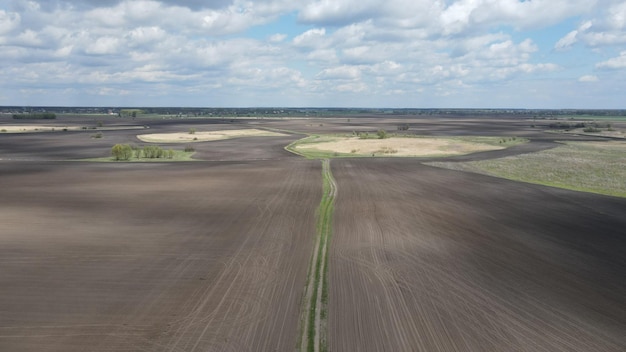 Aerial top view photo from flying drone of a land with down fields in countryside.