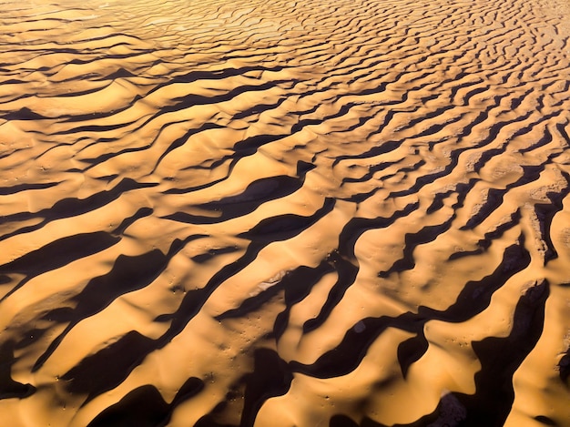 Aerial top view on sand dunes in desert