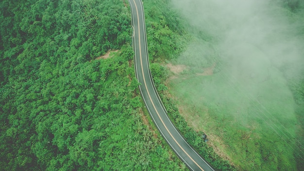 Aerial top view of sky road over top of mountain