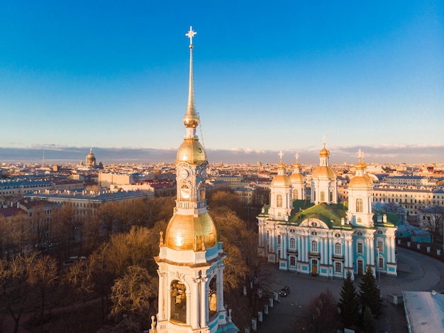 Aerial top view to st nicholas naval sea cathedral in sunny day panorama of evening historical city center orthodox church located on banks of kryukov and griboyedov canal saint petersburg russia
