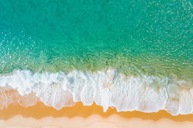 Aerial tranquility mesmerizing waves caressing pristine sands from above painting a coastal canvas