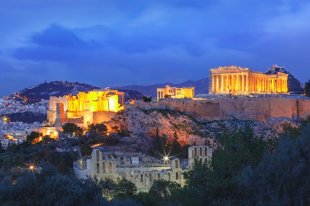 Aerial view of the Acropolis Hill, crowned with Parthenon during evening blue hour in Athens, Greece