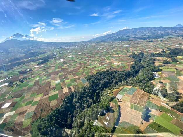 Aerial view of agricultural field against sky