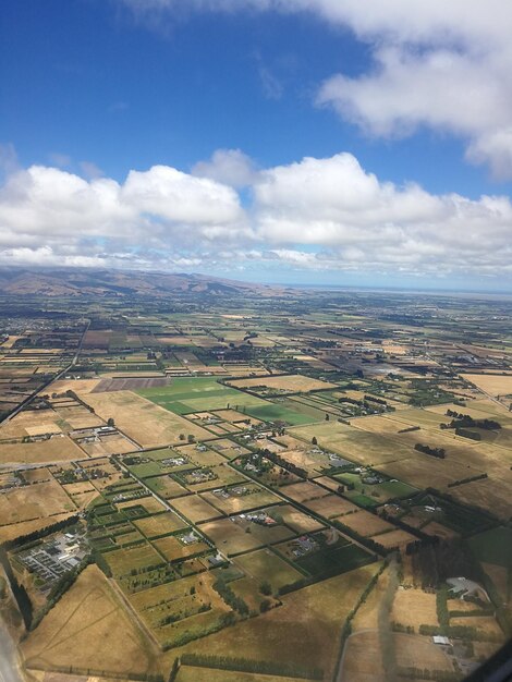 Aerial view of agricultural field against sky