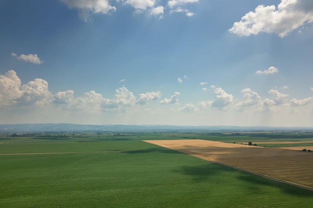 Aerial view of agricultural fields. Cloudy countryside, Aerial view.