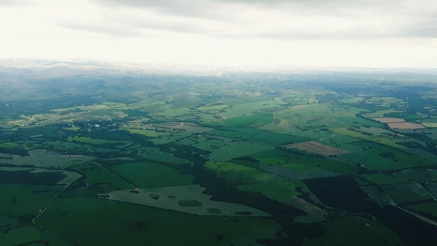 Aerial view of agricultural landscape against sky