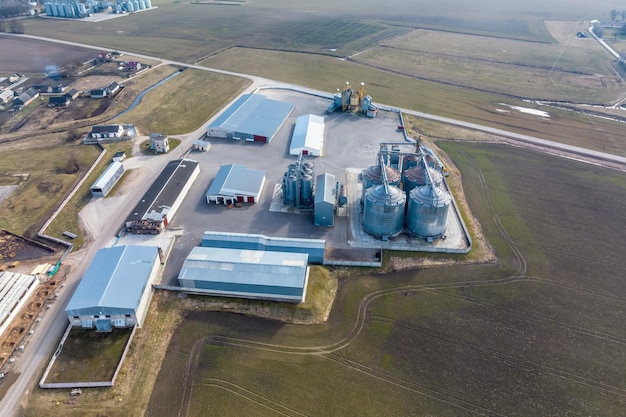 Aerial view of agroindustrial complex with silos and grain drying line