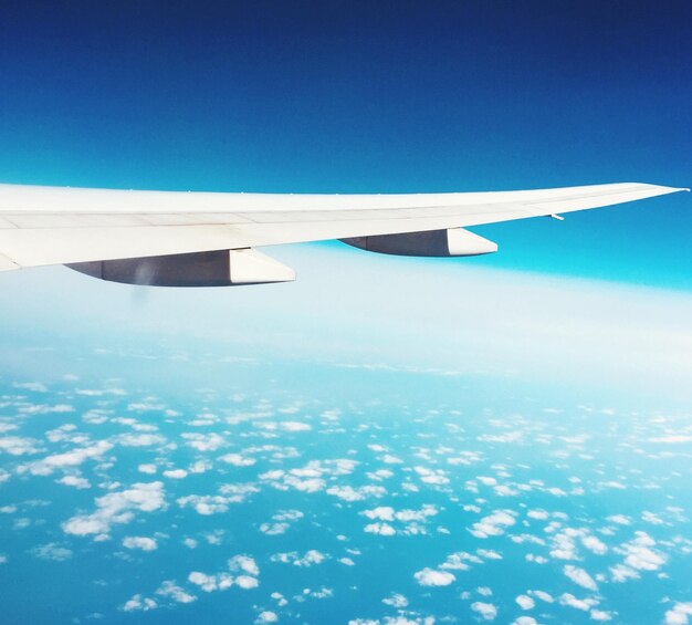 Photo aerial view of airplane flying in sky