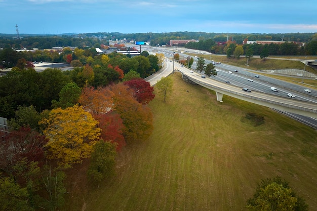 Aerial view of american freeway intersection with fast moving cars and trucks USA transportation infrastructure concept