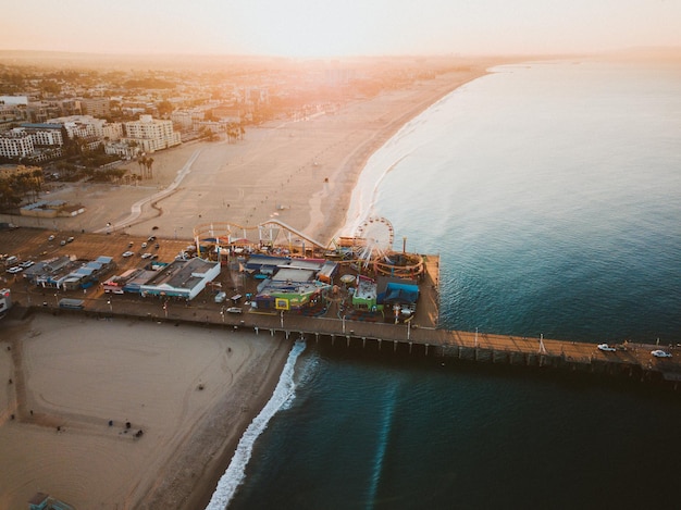 aerial view of amusement park at beach during sunset