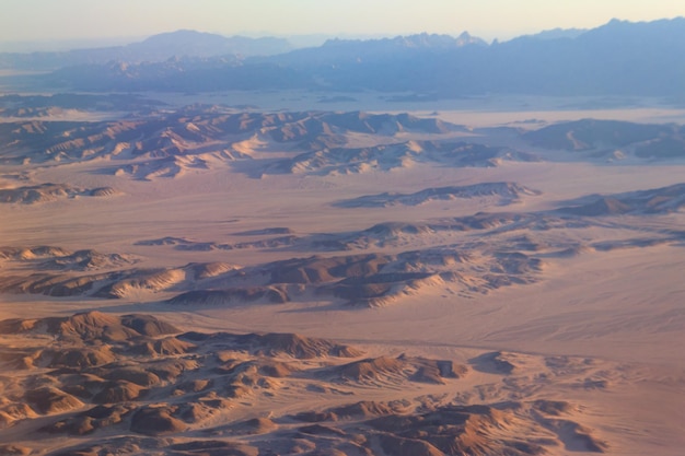 Aerial view of Arabian desert and mountain range Red Sea Hills near Hurghada Egypt View from airplane