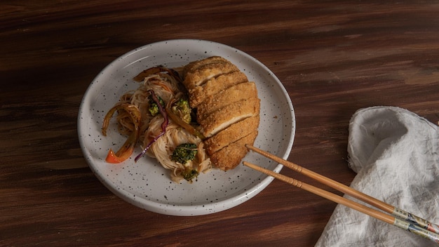 Aerial view of asian food, vegan recipe noodles over wood dinner table with copy space