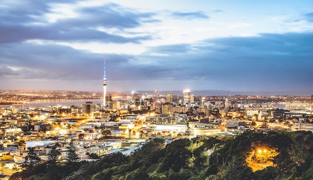 Aerial view of Auckland skyline from Mount Eden after sunset during blue hour