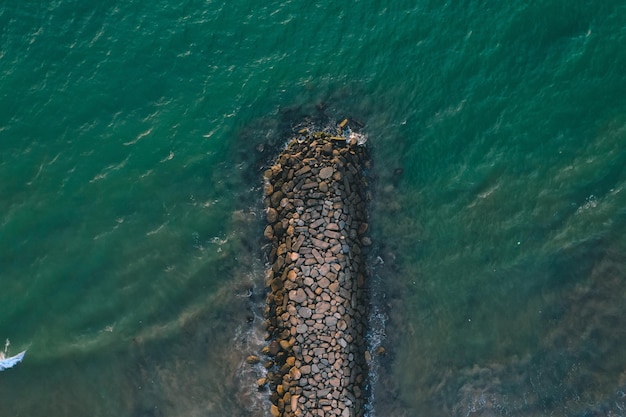 Photo aerial view for the background of the breakwater grip rock