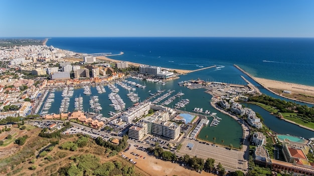 Aerial view of the bay of the marina, with luxury yachts in Vilamoura, Algarve.