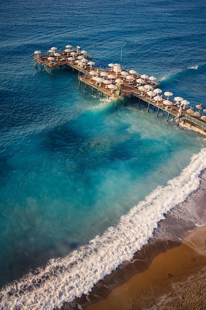 Aerial view of the beach and the mediterranean sea beautiful clear sea water on a warm sunny day the concept of rest in a warm country