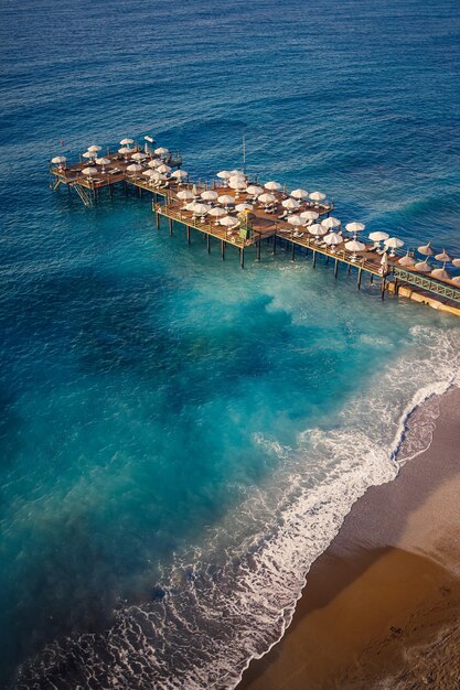 Aerial view of the beach and the mediterranean sea beautiful clear sea water on a warm sunny day The concept of rest in a warm country