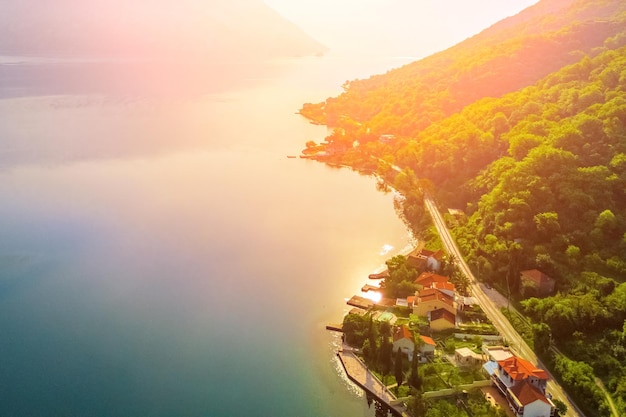 Aerial view of the beautiful European village by the sea at sunset