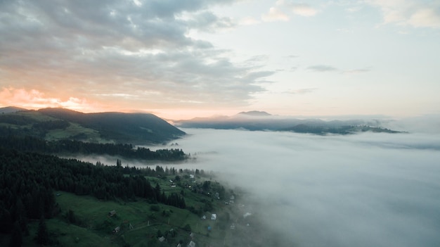 Aerial view a beautiful and foggy landscape and mountains