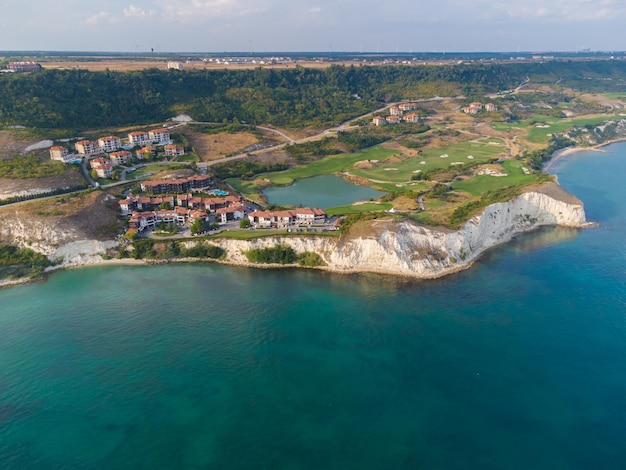 Aerial view of beautiful luxury outdoor swimming pool in hotel resort near the sea